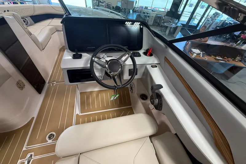 Slide: The Image of Interior view of 2027 Regal LS9 boat cockpit with modern steering and controls. - 23