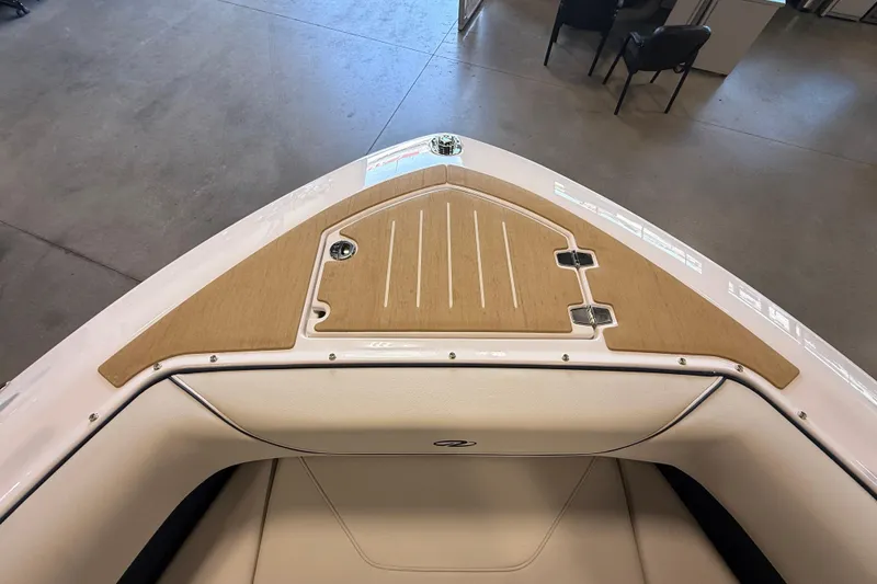 Slide: The Image of 2027 Regal LS9 boat interior with sleek design and wood accents. - 17