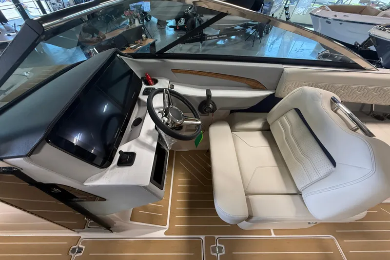 Slide: The Image of 2027 Regal LS9 boat interior with modern dashboard and luxurious seating. - 22