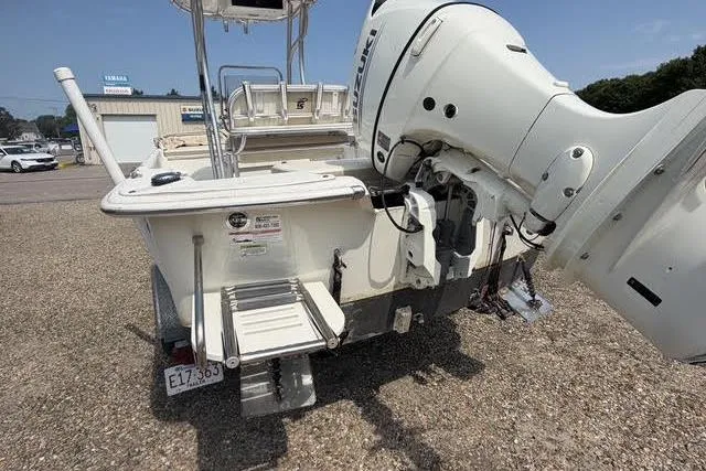 Slide: The Image of 2017 Carolina Skiff 21 DLX boat with outboard motor and swim platform. - 4