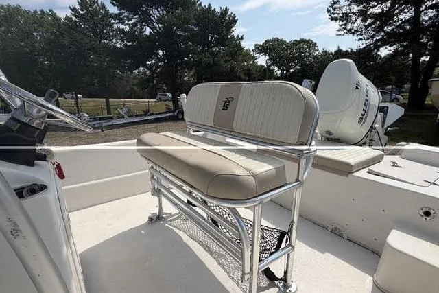 Slide: The Image of 2017 Carolina Skiff 21 DLX boat interior with seating and steering console. - 6