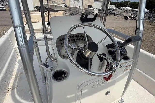 Slide: The Image of 2017 Carolina Skiff 21 DLX boat console with steering wheel and controls. - 7