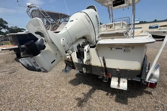 Slide: The Image of 2017 Carolina Skiff 21 DLX boat with outboard motor on a trailer. - 5