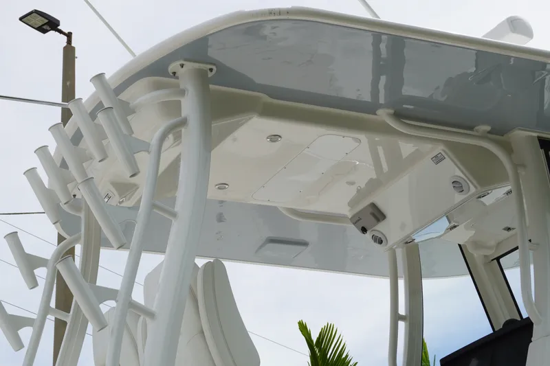 Slide: The Image of 2027 Regulator 31 boat's T-top with rod holders and electronics. - 7