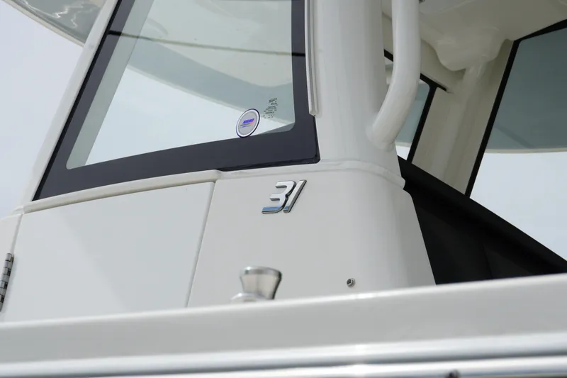 Slide: The Image of Close-up of 2027 Regulator 31 boat model emblem and window detail. - 2
