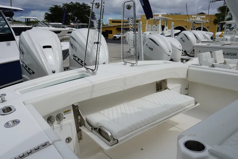 Slide: The Image of 2027 Regulator 31 boat with Yamaha engines, featuring a sleek white interior and seating. - 4
