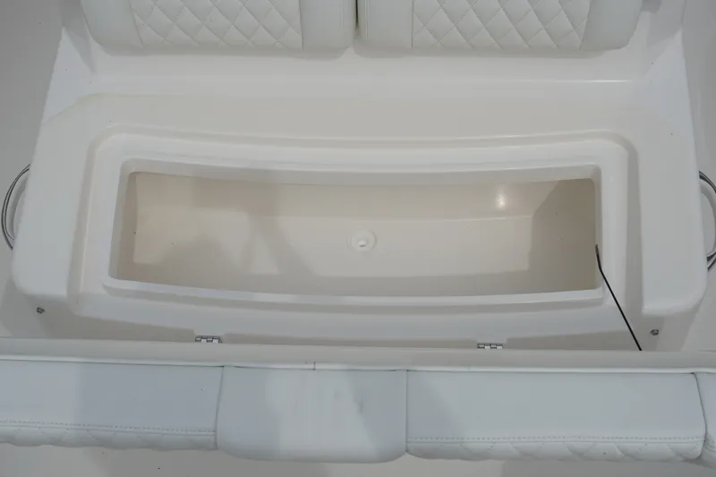 Slide: The Image of 2027 Regulator 31 boat seat with integrated storage compartment, featuring quilted upholstery. - 16