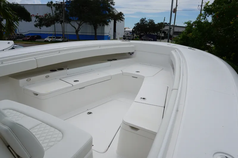 Slide: The Image of Spacious seating area on a 2027 Regulator 31 boat, featuring sleek white design. - 11