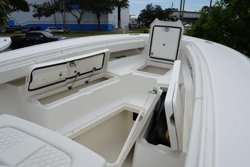 Slide: The Image of 2027 Regulator 31 boat interior with open storage compartments and seating. - 12