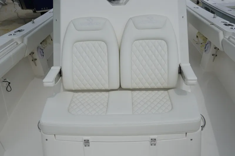 Slide: The Image of Luxurious white seating on 2027 Regulator 31 boat, featuring diamond-patterned upholstery. - 15