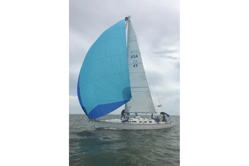 Slide: The Image of Sailing yacht Saga 43 (2002) with blue spinnaker on open water. - 1