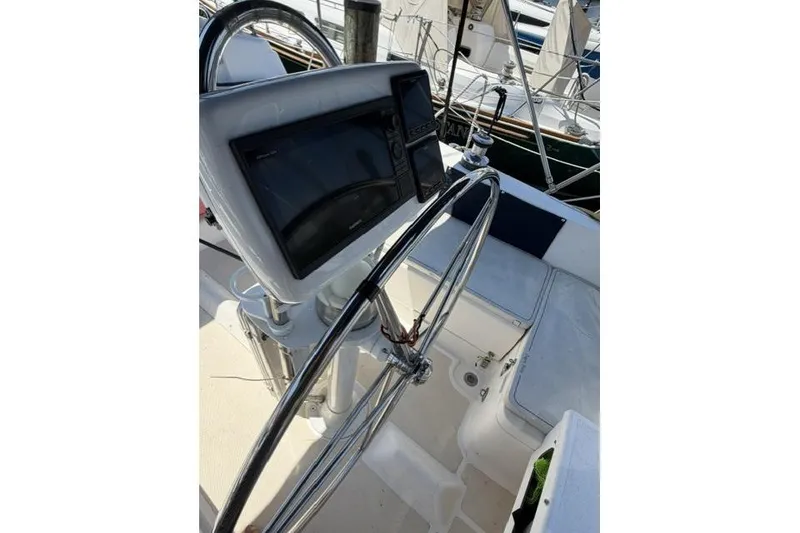 Slide: The Image of Steering wheel and navigation system on 2002 Saga 43 sailboat deck. - 10
