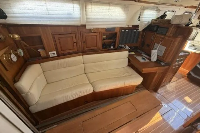 Slide: The Image of Interior of 2002 Saga 43 yacht with wooden finish and cream sofa. - 21