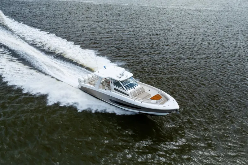 Slide: The Image of 2017 Boston Whaler 420 Outrage cruising swiftly on open water. - 11