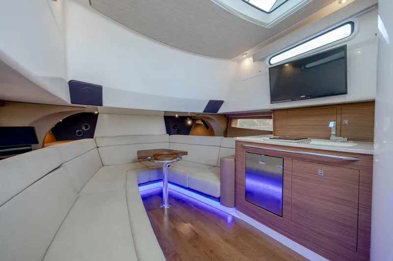 Slide: The Image of Luxurious interior of 2017 Boston Whaler 420 Outrage with modern seating and entertainment area. - 29