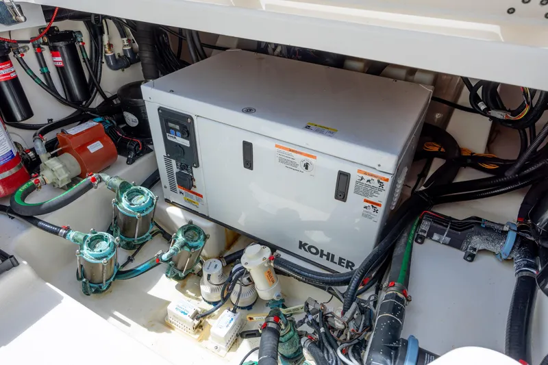 Slide: The Image of Engine room of 2017 Boston Whaler 420 Outrage with Kohler generator and marine equipment. - 50