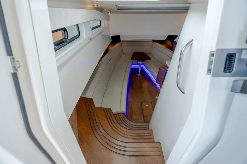 Slide: The Image of Luxurious interior of 2017 Boston Whaler 420 Outrage with elegant seating and ambient lighting. - 26