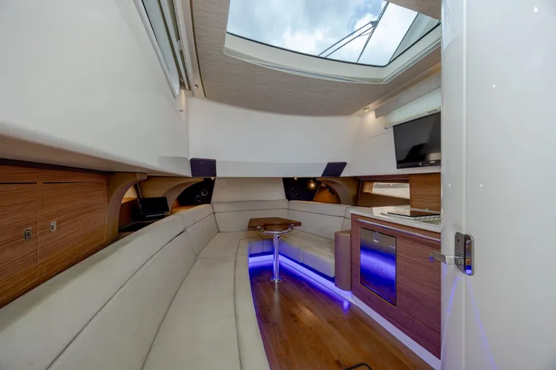 Slide: The Image of Luxurious interior of 2017 Boston Whaler 420 Outrage with modern seating and ambient lighting. - 27
