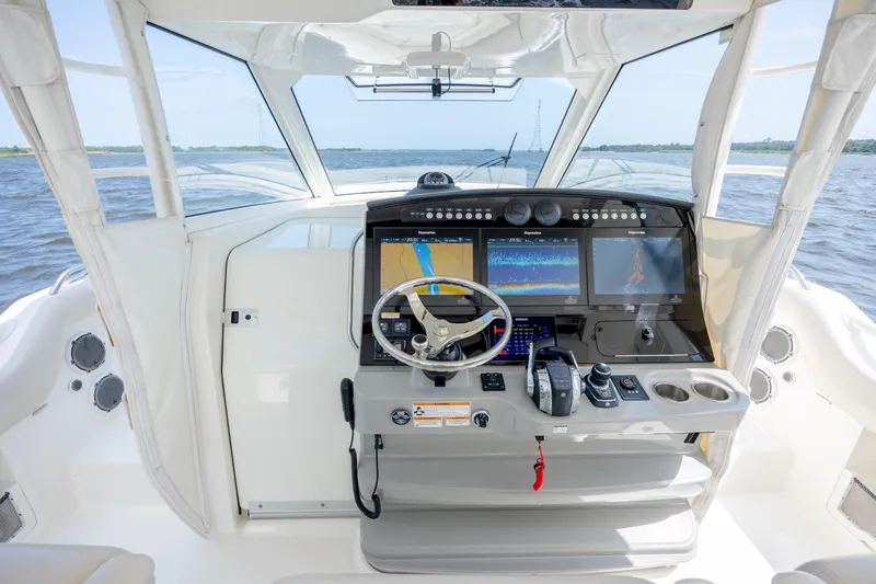 Slide: The Image of 2017 Boston Whaler 420 Outrage helm with advanced navigation displays and controls. - 20