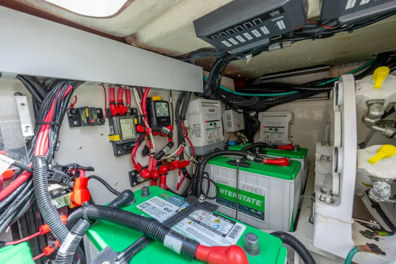 Slide: The Image of Electrical system of a 2017 Boston Whaler 420 Outrage, featuring batteries and wiring. - 54