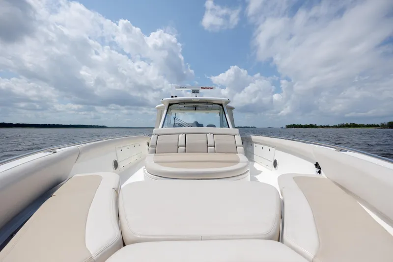Slide: The Image of 2017 Boston Whaler 420 Outrage boat on open water under cloudy sky. - 61