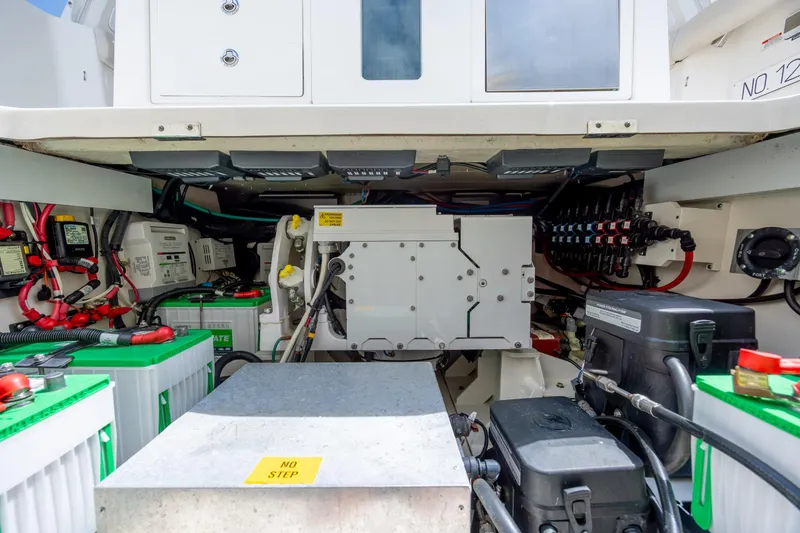 Slide: The Image of Engine compartment of a 2017 Boston Whaler 420 Outrage, showcasing electrical systems and components. - 53