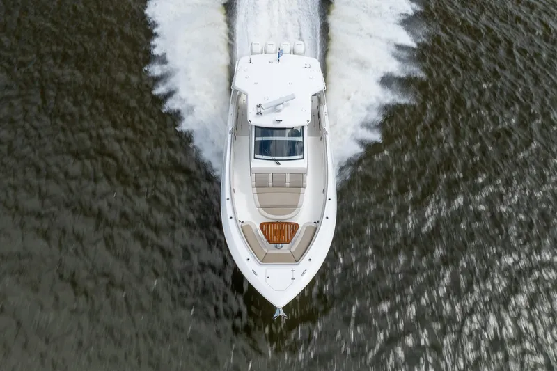 Slide: The Image of 2017 Boston Whaler 420 Outrage cruising on water, aerial view. - 15