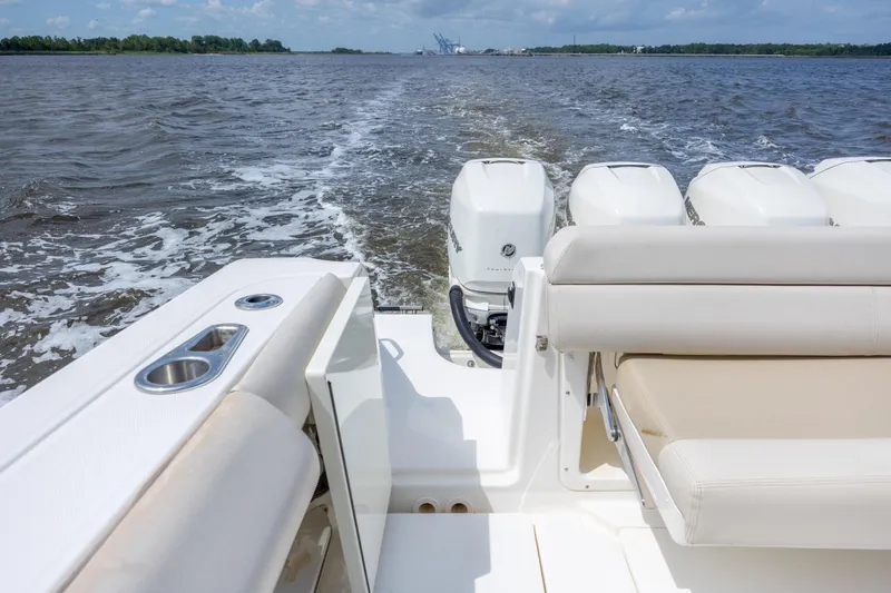 Slide: The Image of 2017 Boston Whaler 420 Outrage boat cruising on open water, showcasing powerful engines. - 72