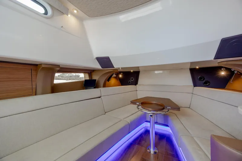 Slide: The Image of Luxurious interior of 2017 Boston Whaler 420 Outrage with elegant seating and ambient lighting. - 30