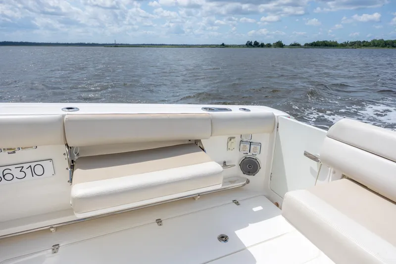 Slide: The Image of 2017 Boston Whaler 420 Outrage boat interior with seating, on a sunny day. - 70