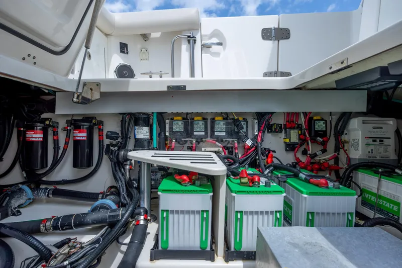 Slide: The Image of Electrical system of a 2017 Boston Whaler 420 Outrage boat, featuring batteries and wiring. - 52