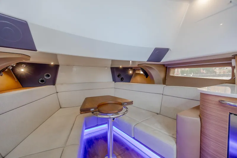 Slide: The Image of Luxurious interior of 2017 Boston Whaler 420 Outrage with ambient lighting and plush seating. - 31