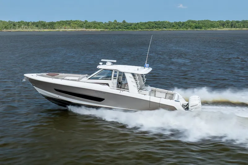 Slide: The Image of 2017 Boston Whaler 420 Outrage cruising swiftly on open water. - 9