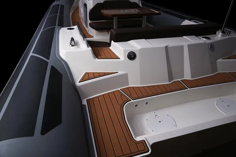 Slide: The Image of 2027 Brig Eagle 10 boat with sleek design and wood accents on deck. - 11