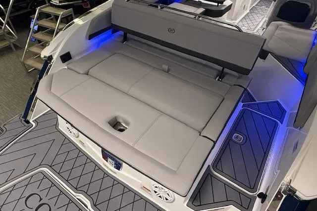 Slide: The Image of 2026 Cobalt R6 boat interior with luxurious seating and ambient blue lighting. - 14