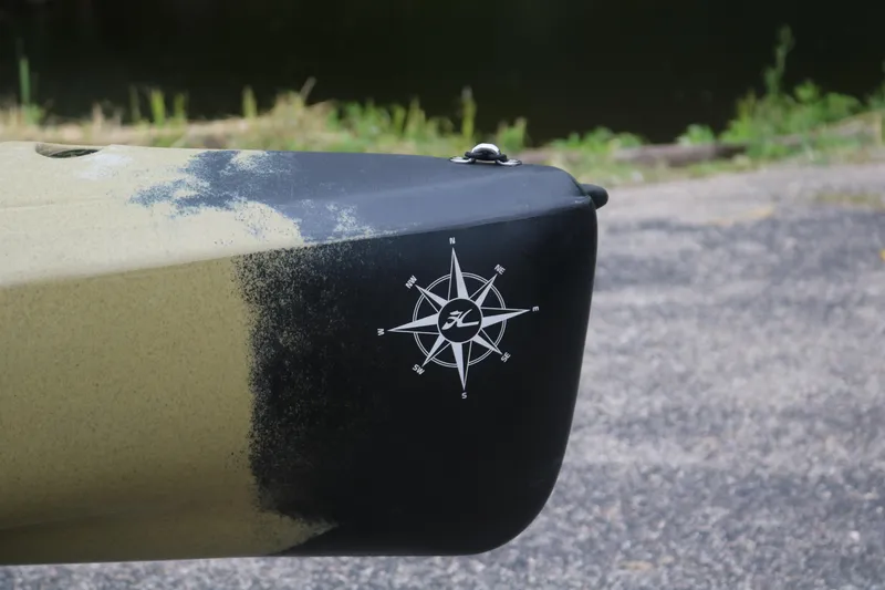 Slide: The Image of Close-up of 2023 Hobie Mirage Compass kayak bow with compass logo. - 3