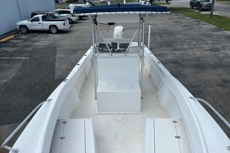 Slide: The Image of 2007 Duskey 256 boat with center console, parked in a lot. - 14