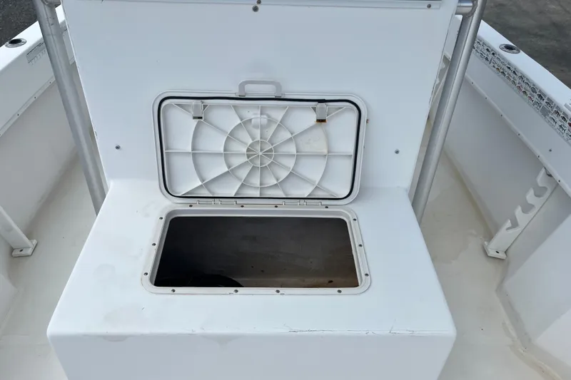 Slide: The Image of Open storage compartment on a 2007 Duskey 256 boat, showcasing interior space. - 12