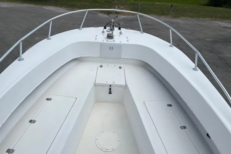 Slide: The Image of Duskey 256 boat deck, 2007 model, featuring clean white surface and metal railings. - 7