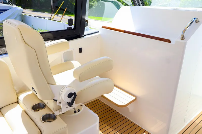 Slide: The Image of Luxury seating on 2022 MJM 3z boat with cup holders and armrests. - 13