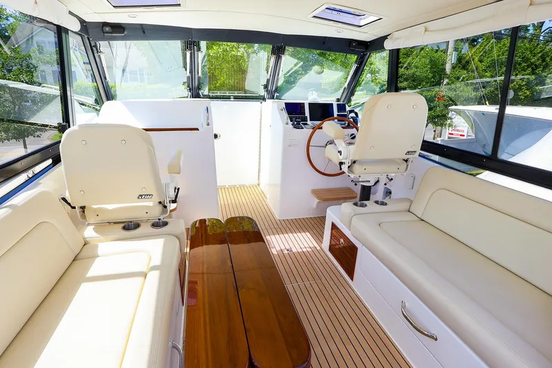 Slide: The Image of Luxurious interior of 2022 MJM 3z boat with plush seating and modern helm. - 12