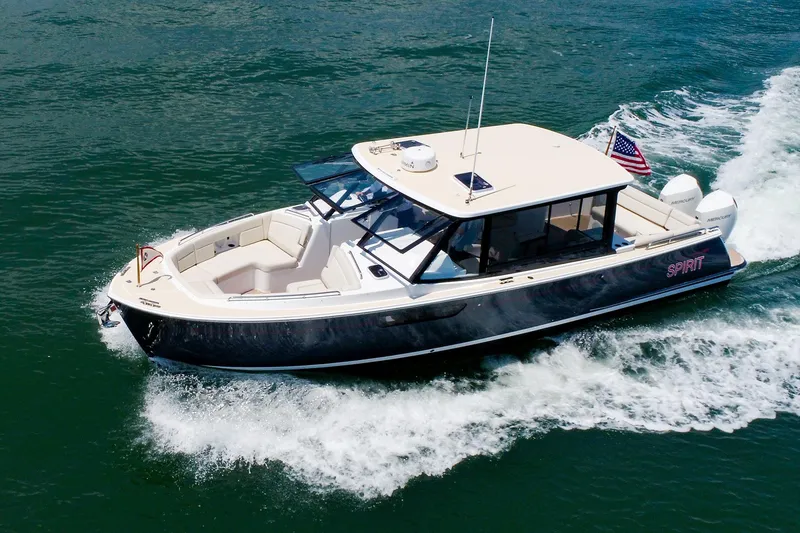 The Image of 2022 MJM 3z boat cruising on water with American flag displayed. - 0