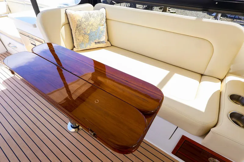 Slide: The Image of Luxurious MJM 3z 2022 yacht interior with elegant seating and polished wooden table. - 19
