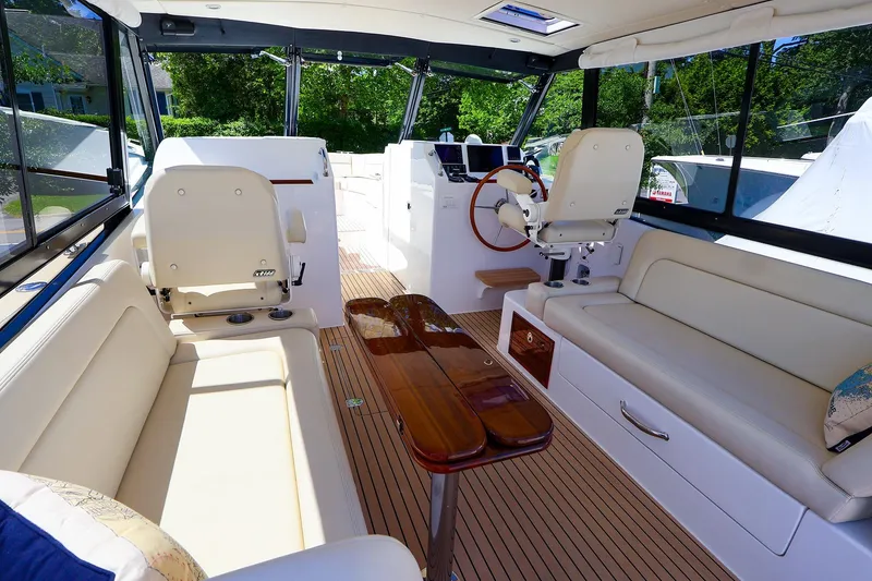 Slide: The Image of Luxurious interior of 2022 MJM 3z boat with plush seating and wooden accents. - 18