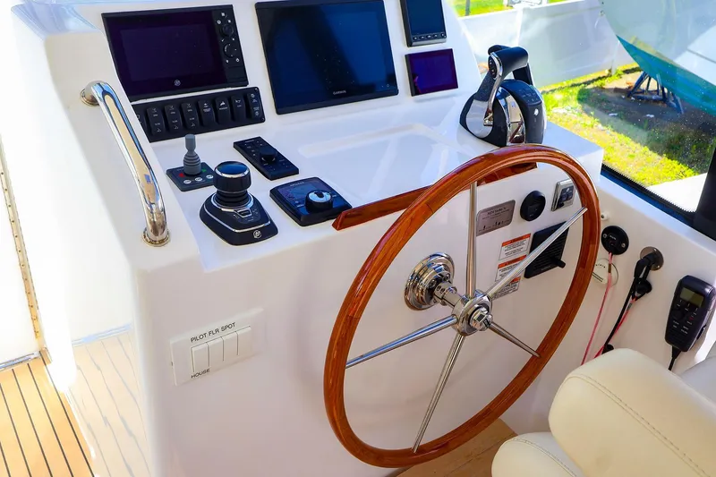 Slide: The Image of Helm of 2022 MJM 3z boat with wooden steering wheel and modern controls. - 10
