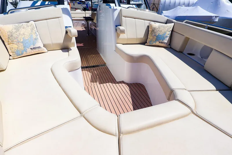 Slide: The Image of Luxurious seating area on a 2022 MJM 3z boat with map-themed cushions. - 26