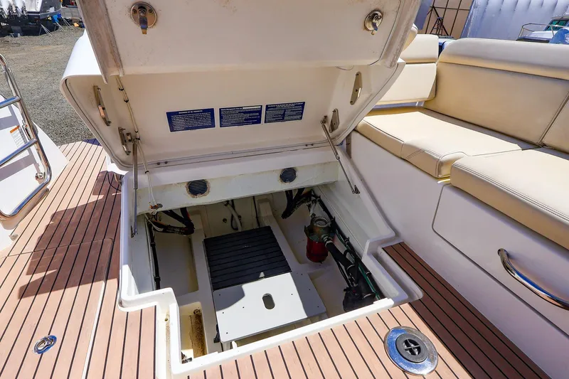Slide: The Image of Open engine compartment of 2022 MJM 3z boat with teak flooring and seating. - 41