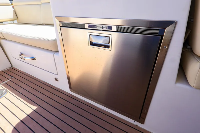 Slide: The Image of Stainless steel appliance on MJM 3z boat, 2022 model, with teak flooring and beige seating. - 21