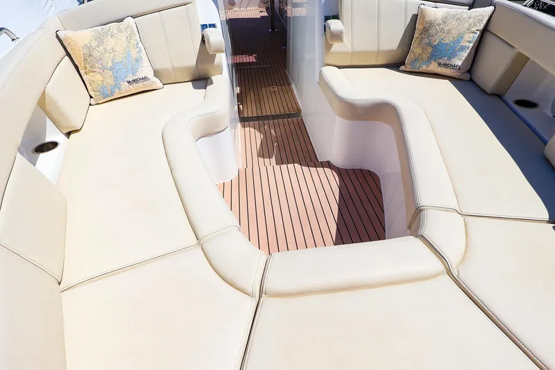 Slide: The Image of Luxurious seating area on 2022 MJM 3z boat with map-themed cushions. - 25