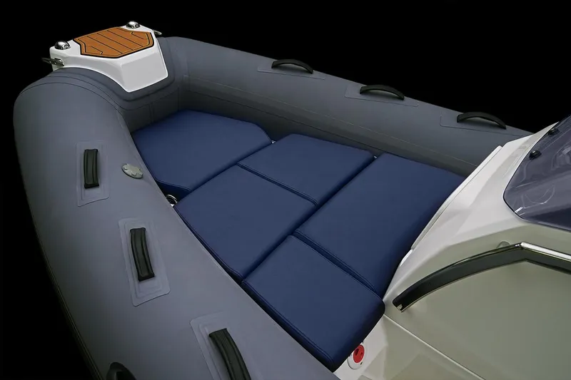 Slide: The Image of Manufacturer Provided Image: 2026 Brig Eagle 4 inflatable boat with blue cushions, gray hull. - 2